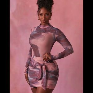 Oh Polly set. Mesh body suit and tie front skirt. Sold together not separate